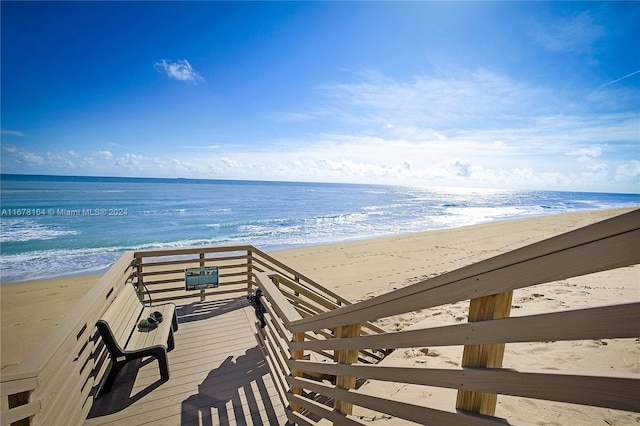 view of property's community with a view of the beach and a water view