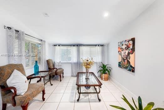 living area with light tile patterned floors