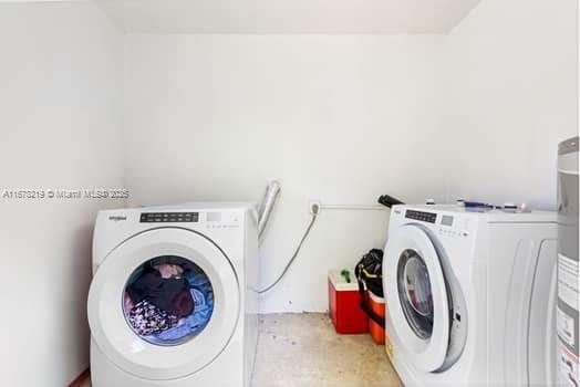 laundry room with washer and dryer