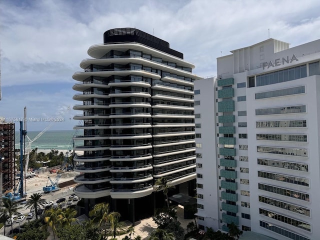 view of building exterior with a water view