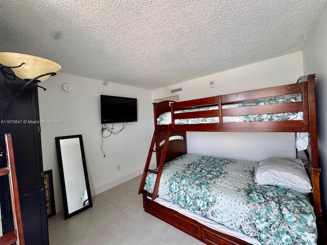 bedroom featuring a textured ceiling