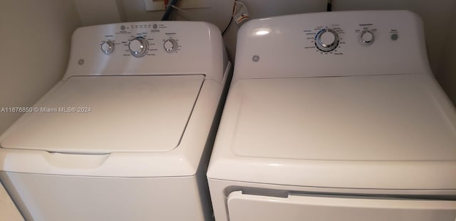 laundry room with washer and clothes dryer and laundry area