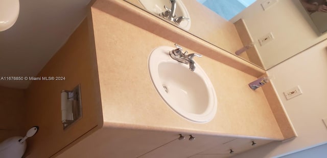 bathroom with vanity and a skylight