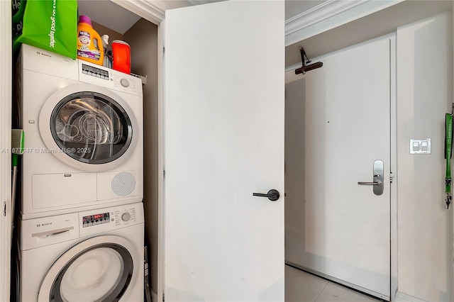 washroom with stacked washer and dryer