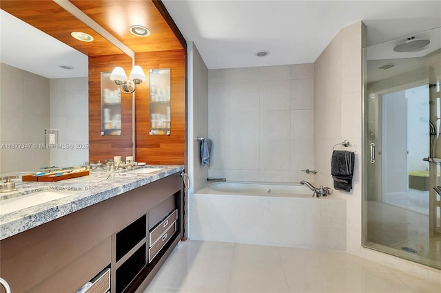 bathroom featuring tile walls, independent shower and bath, and tile patterned floors