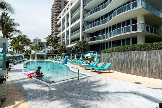 view of swimming pool featuring a patio area