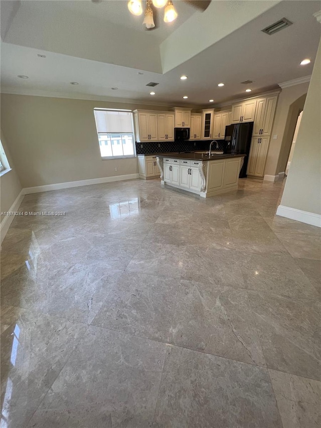 kitchen featuring ornamental molding, black appliances, a center island, sink, and tasteful backsplash