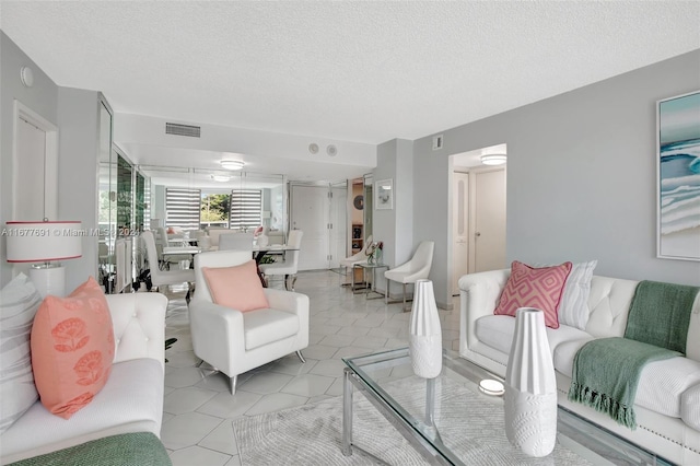 living room with a textured ceiling