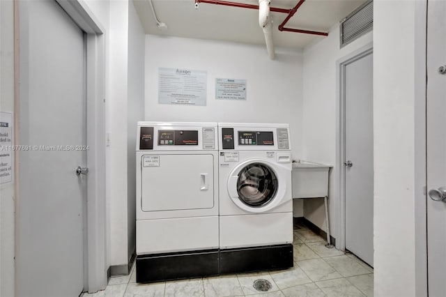 laundry area with washer and clothes dryer