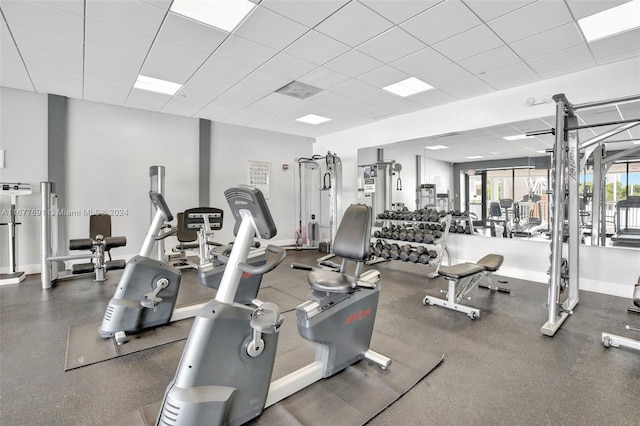 exercise room featuring a drop ceiling