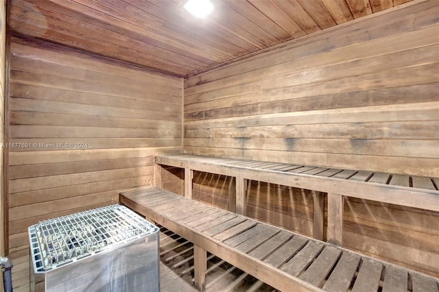 view of sauna / steam room featuring wood ceiling, wood walls, and hardwood / wood-style floors