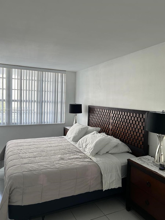 bedroom featuring light tile patterned floors