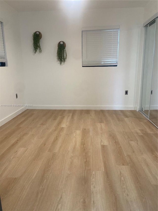 empty room with light wood-type flooring