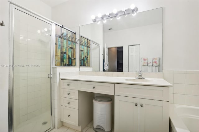 bathroom with a bath, a shower stall, and vanity