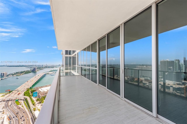 balcony featuring a water view