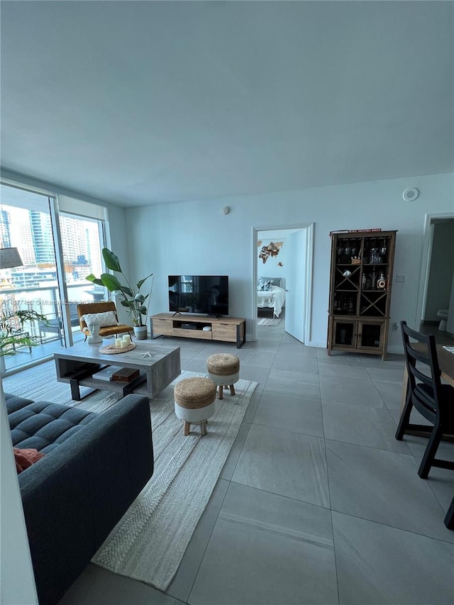 living room with tile patterned floors