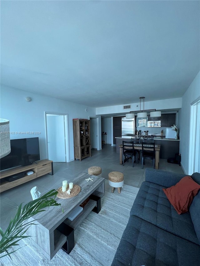 living room with tile patterned floors