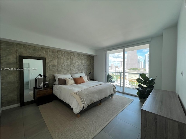 tiled bedroom featuring access to exterior