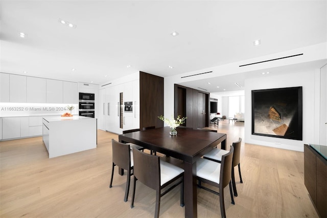 dining space featuring light hardwood / wood-style flooring