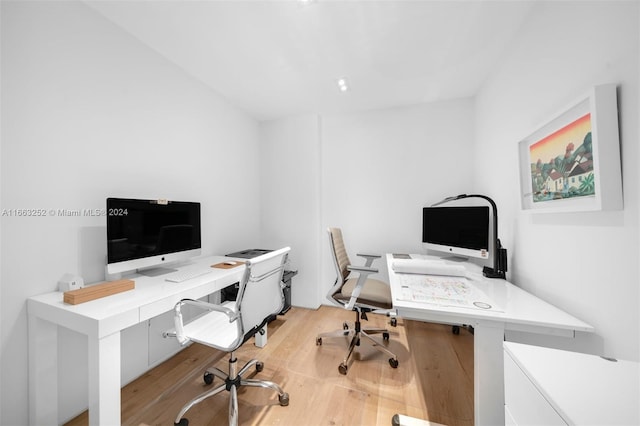 office area with light hardwood / wood-style floors