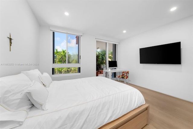 bedroom with light wood-type flooring