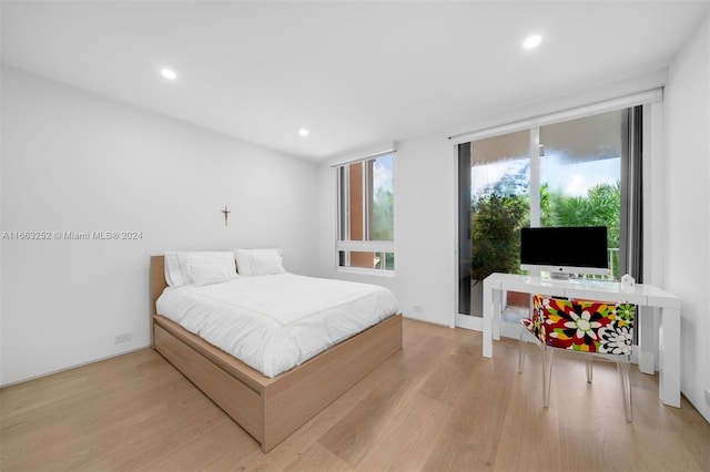 bedroom with light hardwood / wood-style flooring