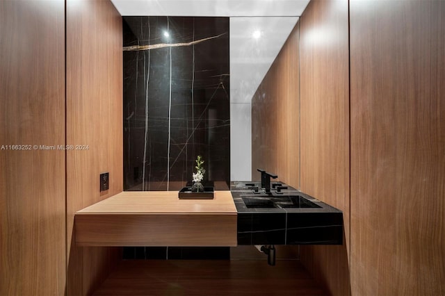 bathroom with hardwood / wood-style flooring