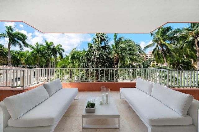 view of patio featuring a balcony and outdoor lounge area