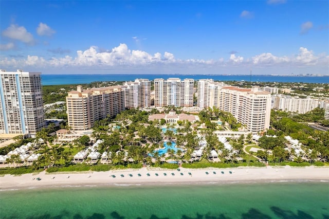 birds eye view of property with a view of the beach and a water view