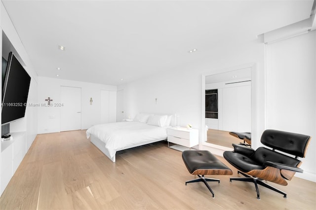 bedroom with light hardwood / wood-style floors