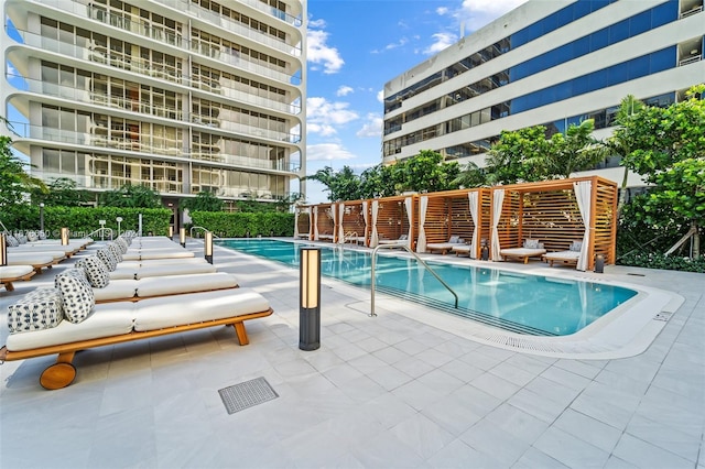 view of swimming pool featuring a patio