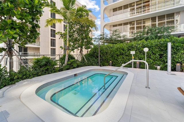 view of swimming pool featuring a patio area