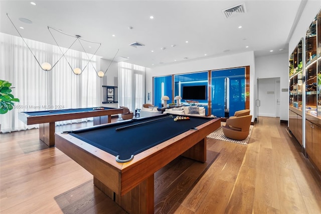 rec room with pool table and light hardwood / wood-style floors