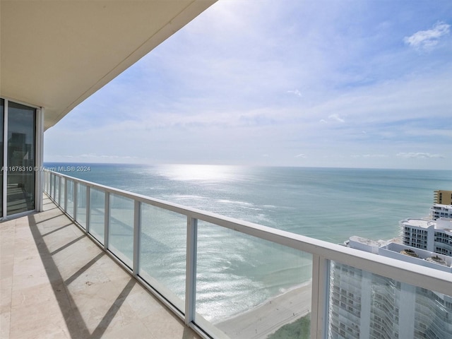 balcony featuring a water view