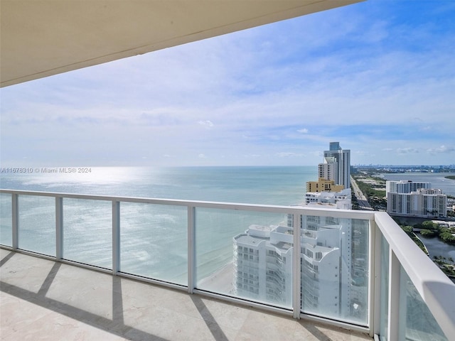 balcony featuring a water view