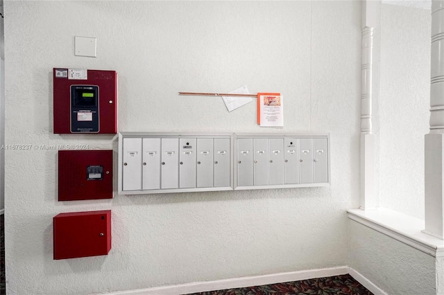 6600 NE 22nd Way Unit 2303, Fort Lauderdale, FL 33308 - detailed view of mail area, a fire alarm, and baseboards