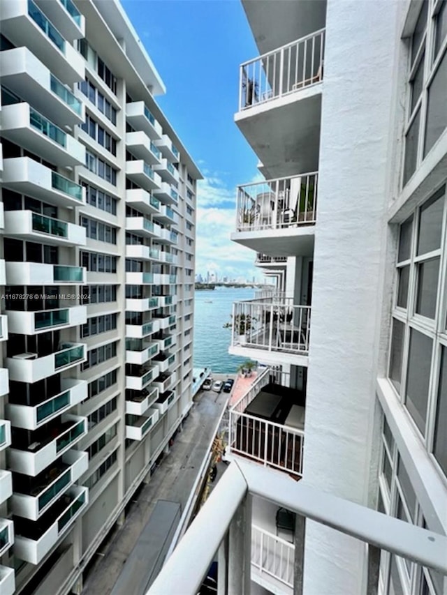 balcony featuring a water view