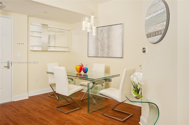 dining space with hardwood / wood-style flooring