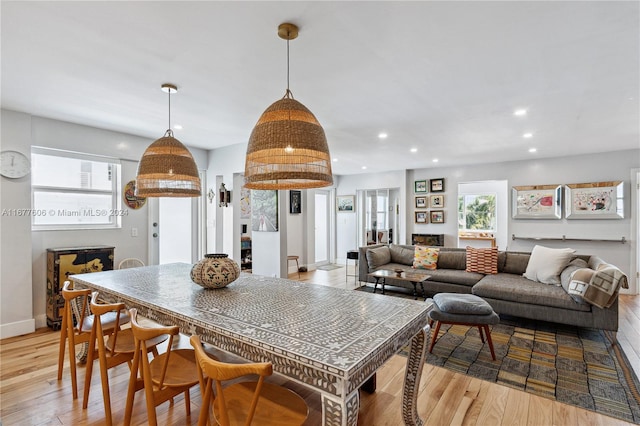 dining space featuring light hardwood / wood-style floors and a wealth of natural light