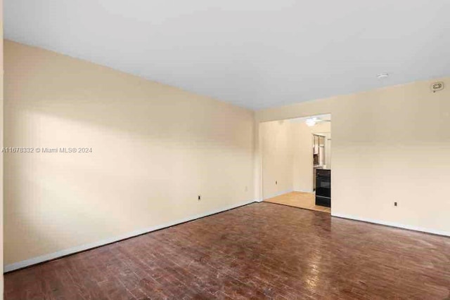 spare room with wood finished floors