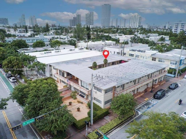 birds eye view of property featuring a view of city