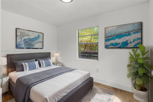 bedroom with wood-type flooring