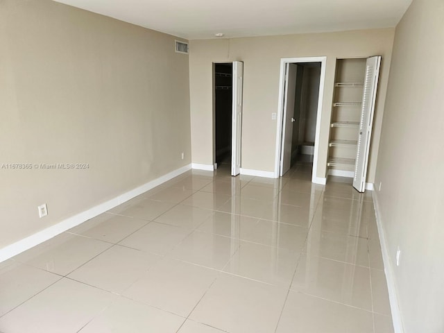 unfurnished bedroom featuring light tile patterned floors