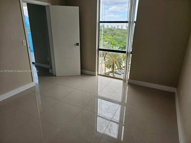 empty room with light tile patterned floors