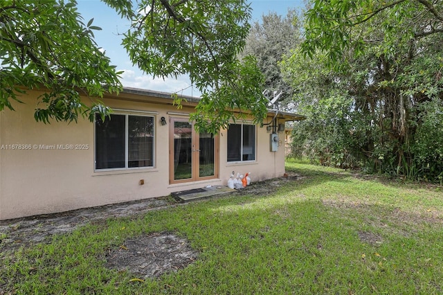 view of yard with french doors