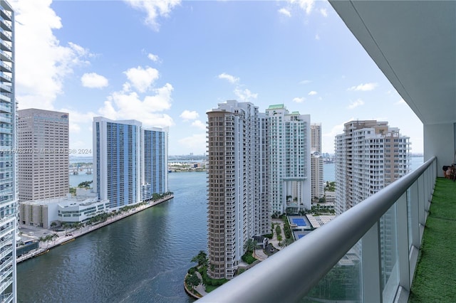 balcony featuring a water view