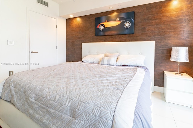 tiled bedroom with wood walls