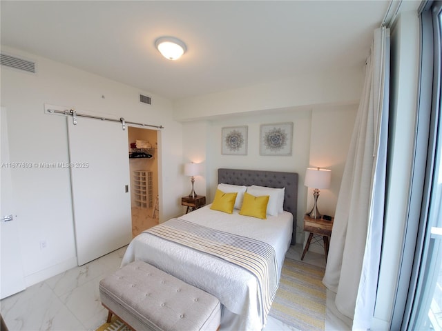 bedroom featuring marble finish floor, a closet, and visible vents