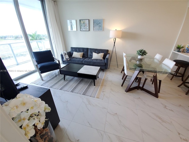 living room featuring marble finish floor