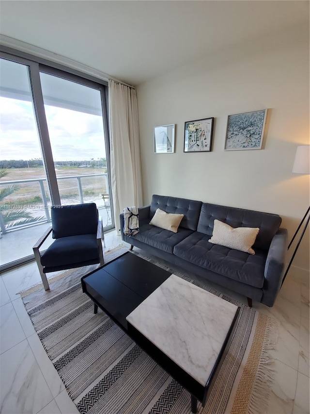 living room with expansive windows and marble finish floor